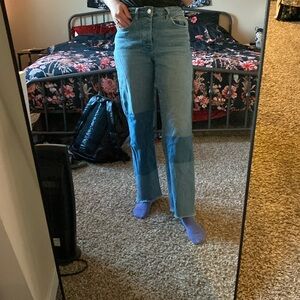 Pair of jeans with color blocking.